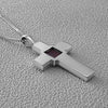 Flatlay of Nano Bible cross necklace in 925 sterling silver. Features a nano-printed chip embedded in the center holding the full King James Version New Testament. Religious Christian jewelry gift for believers seeking a meaningful accessory of faith. Ideal for anniversaries, baptisms, or everyday inspiration.