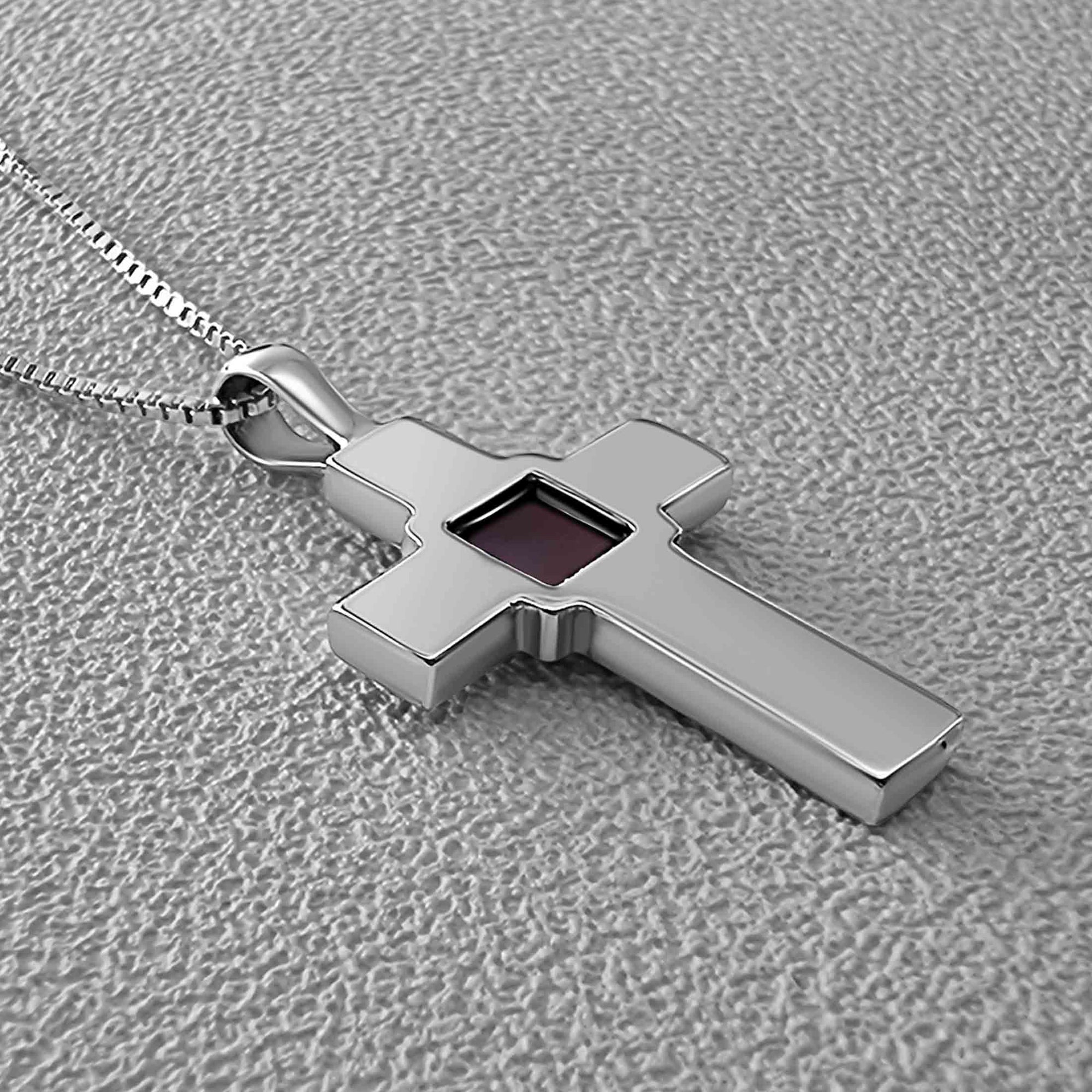 Flatlay of Nano Bible cross necklace in 925 sterling silver. Features a nano-printed chip embedded in the center holding the full King James Version New Testament. Religious Christian jewelry gift for believers seeking a meaningful accessory of faith. Ideal for anniversaries, baptisms, or everyday inspiration.