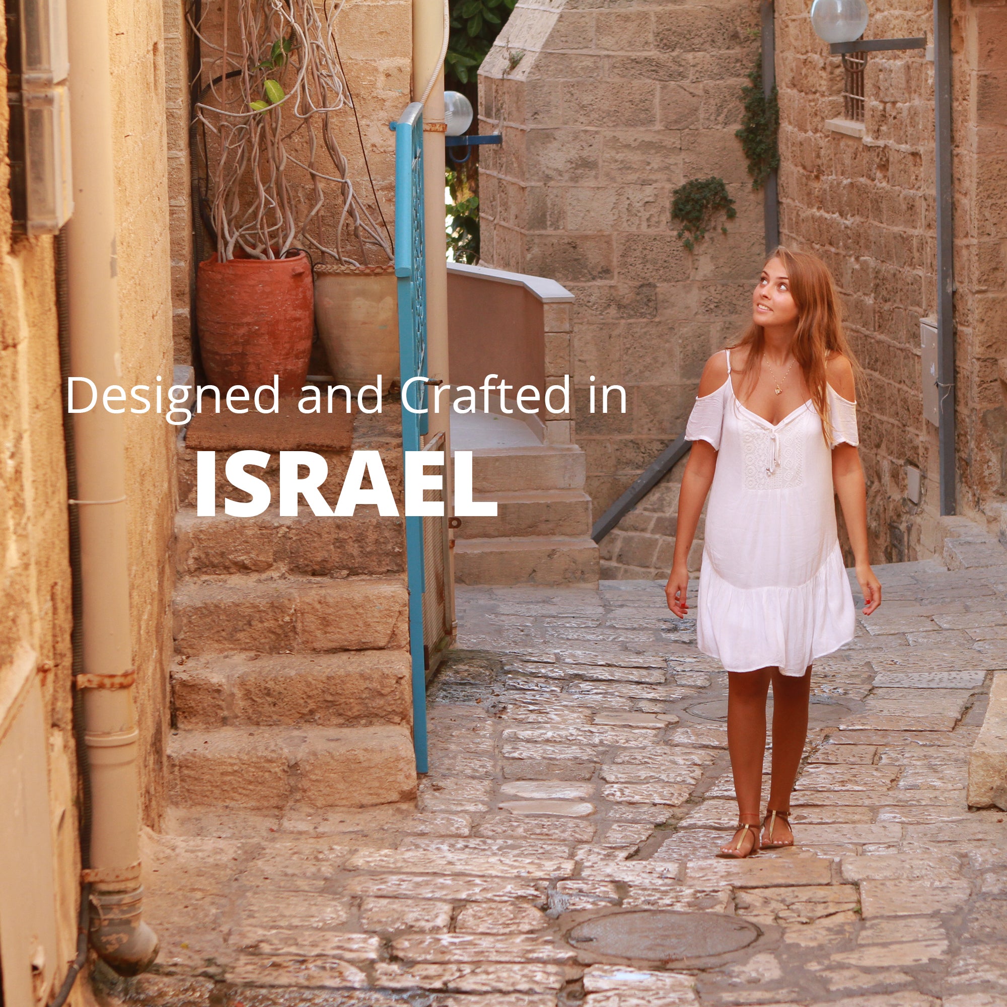 Lifestyle image of woman walking in Israel, wearing Nano Bible necklace. Highlights that NanoStyle jewelry is designed and crafted in Israel.