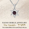Close-up of sterling silver Star of David pendant necklace showcasing the Tanakh nanochip in center. The background features Hebrew script, reinforcing the spiritual depth and Judaic roots of this uniquely crafted Jewish necklace.