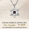 Silver Sacred Fusion Star of David pendant displayed on a scripture-themed background, featuring the Hebrew Tanakh on a micro-sized chip. Timeless Jewish jewelry gift for religious milestones and spiritual expression.
