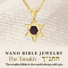 Gold-plated Star of David necklace shown over Hebrew scripture background. Nano-inscribed with the entire Tanakh on a 5mm chip, this meaningful Jewish gift captures spiritual legacy in a modern format, ideal for any religious milestone.