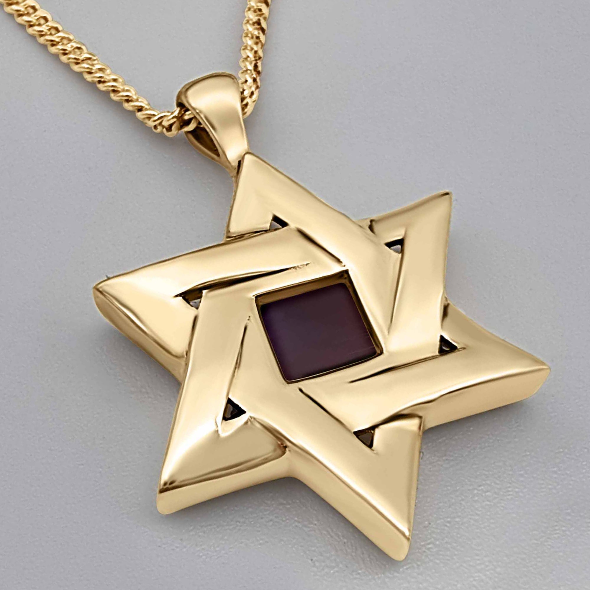 Casual display of the Sacred Fusion silver necklace on a male model, highlighting how the Star of David pendant sits naturally. A discreet and powerful statement of faith, holding the sacred Hebrew Bible close to the heart.