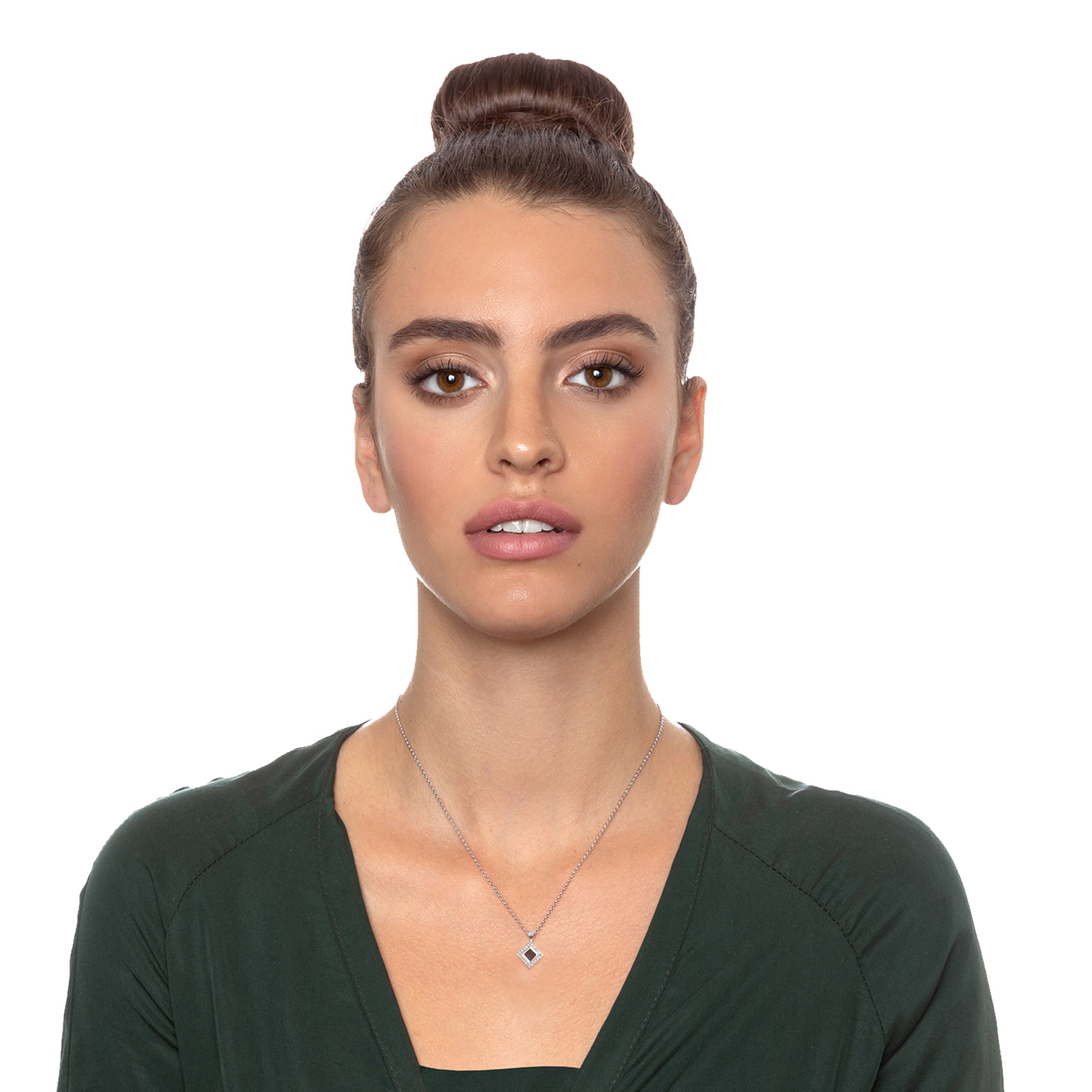 Model wearing sterling silver Judaic Nano Bible necklace, with nano-inscribed Hebrew Tanakh on a square microchip. Cubic zirconia halo pendant on elegant chain. Handcrafted Jewish faith jewelry from Israel. Religious and symbolic necklace gift for spiritual women of faith.